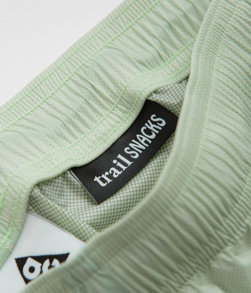 Nike ACG Trail Snacks Pants in Vapor Green and Reflective Silver