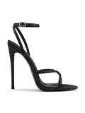 Femme LA Ale Sandal in Satin Black – side profile showing crossed thin toe straps, ankle strap with gold buckle, and slim stiletto heel