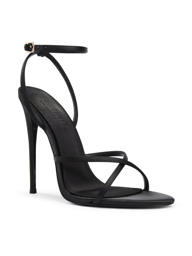 Femme LA Ale Sandal in Satin Black – front three-quarter view showing crossed diagonal toe straps and thin ankle strap with gold buckle