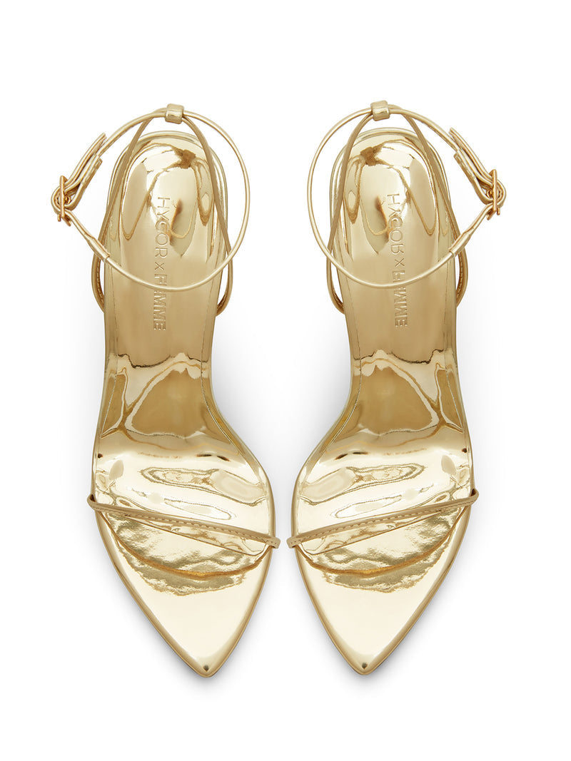 FEMME LA ANDX Sandal liquid gold pair, overhead flat lay showing HYGOR X FEMME embossed insoles and pointed toes