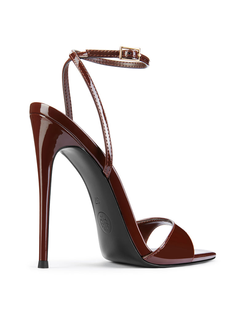 FEMME LA GG Heel in chocolate patent, front-right angle showing FEMME logo on black rubber outsole and toe strap