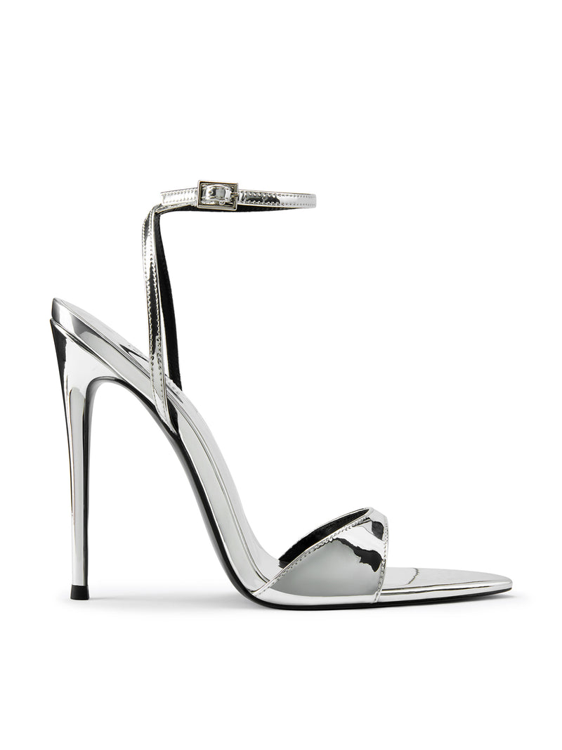 Mirror silver GG Heel strappy sandal by FEMME LA, side view showing single toe strap, ankle strap with buckle, and ultra-slim stiletto