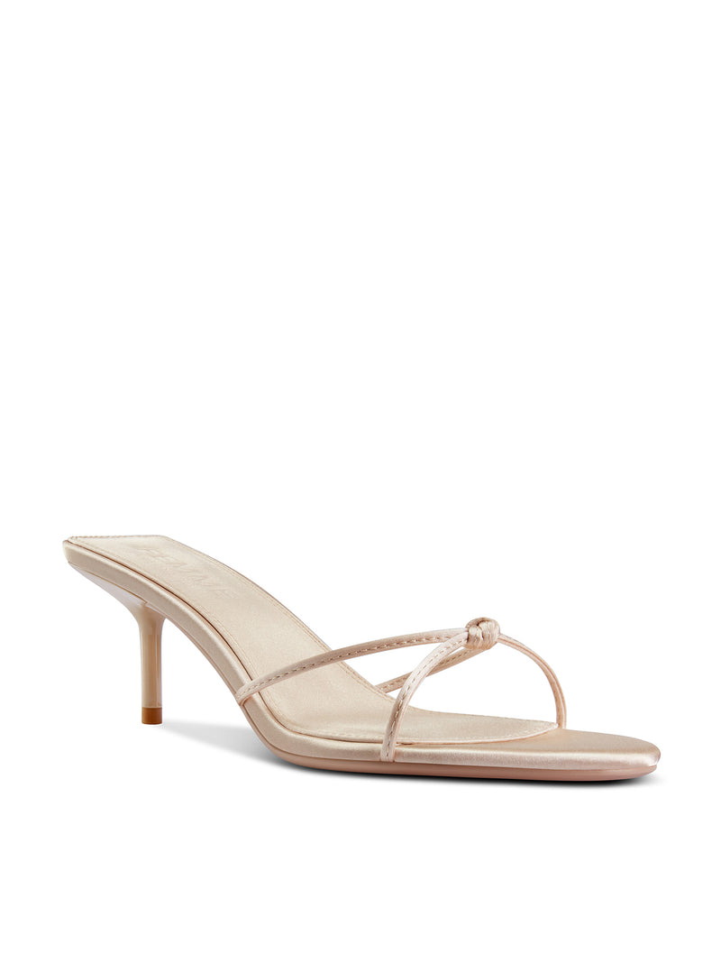 FEMME LA Maeve Slipper in champagne satin, 3/4 front angle showing V-strap with knot detail and open square toe