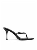 Black thong-style Osaka Slipper mule by FEMME LA, side view showing two thin crossed straps with toe thong and mid stiletto heel