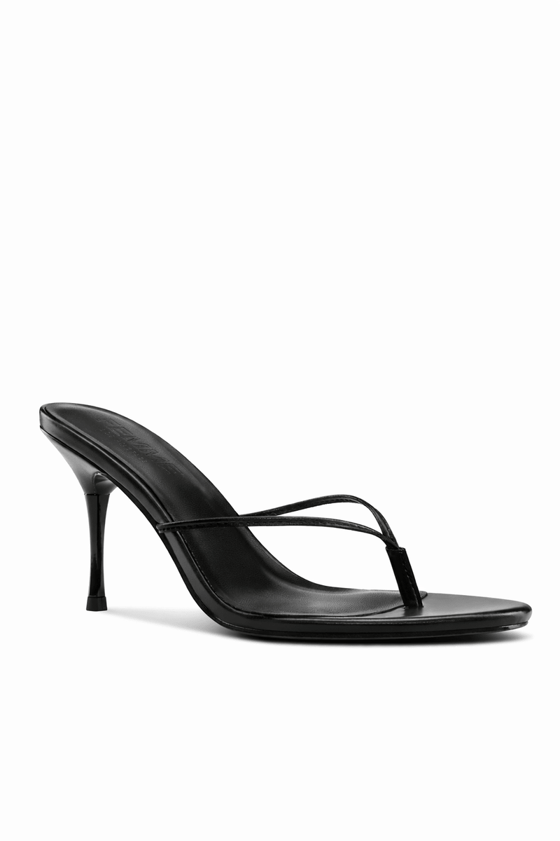FEMME LA Osaka Slipper in black, 3/4 front angle showing thong toe strap detail and FEMME-embossed black insole