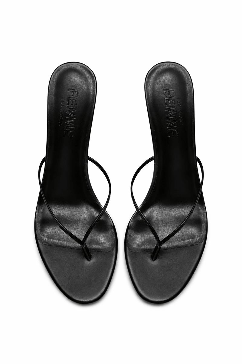 FEMME LA black Osaka Slipper mules, overhead flat lay showing FEMME embossed insoles and thong toe straps