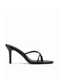 Black smooth leather Sicilian Slipper mule by FEMME LA, side view showing thin crossed straps and mid stiletto heel