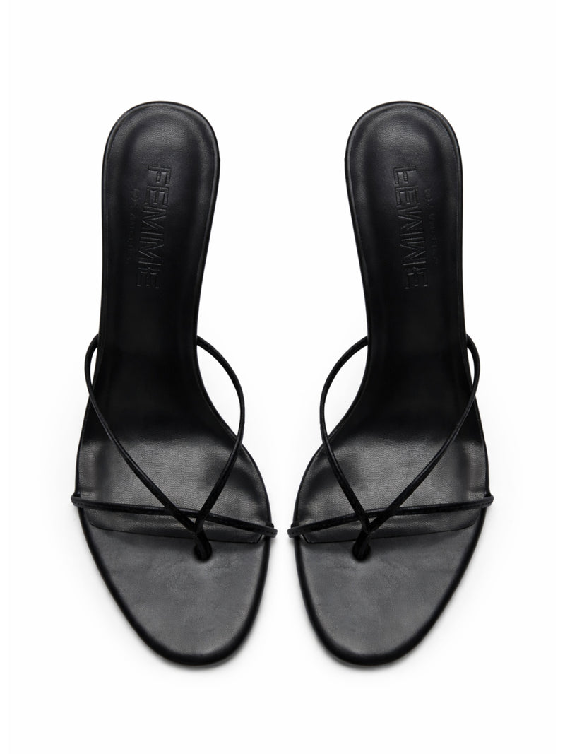FEMME LA black Sicilian Slipper mules, overhead flat lay showing FEMME embossed insoles and crossed toe straps