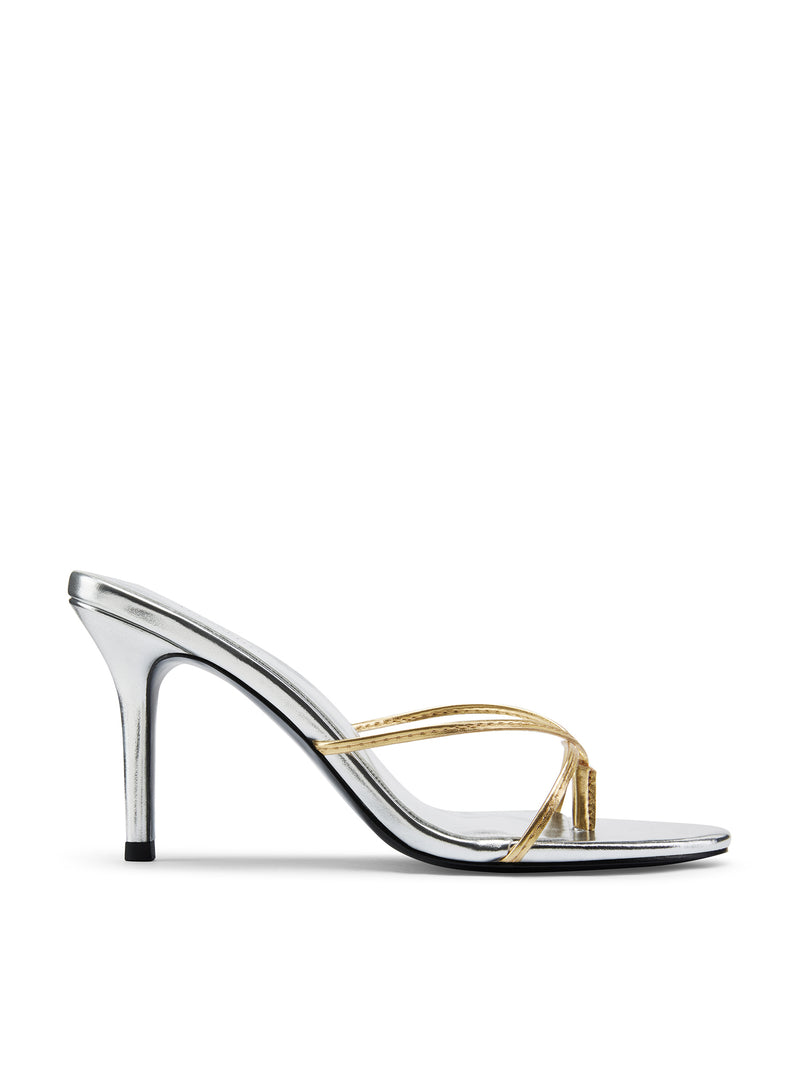 Femme LA Sicilian Slipper in Gold & Silver – side profile showing silver metallic body with contrasting gold crossed straps and black outsole