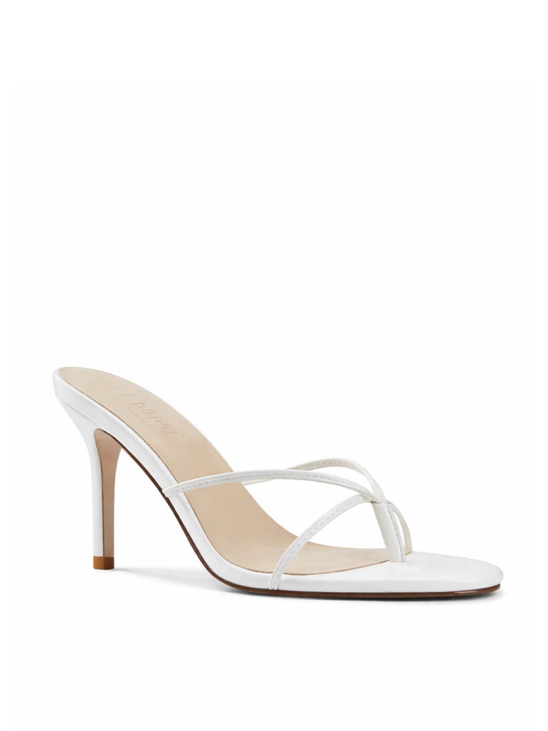 Femme LA Sicilian Slipper in White – front three-quarter view showing white leather crossed straps and FEMME LOS ANGELES on nude insole