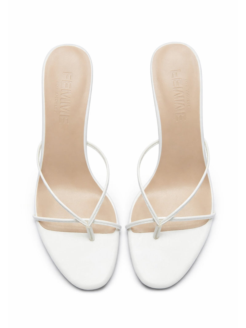 Femme LA Sicilian Slipper in White – overhead view of the pair showing FEMME LOS ANGELES embossed on nude insoles