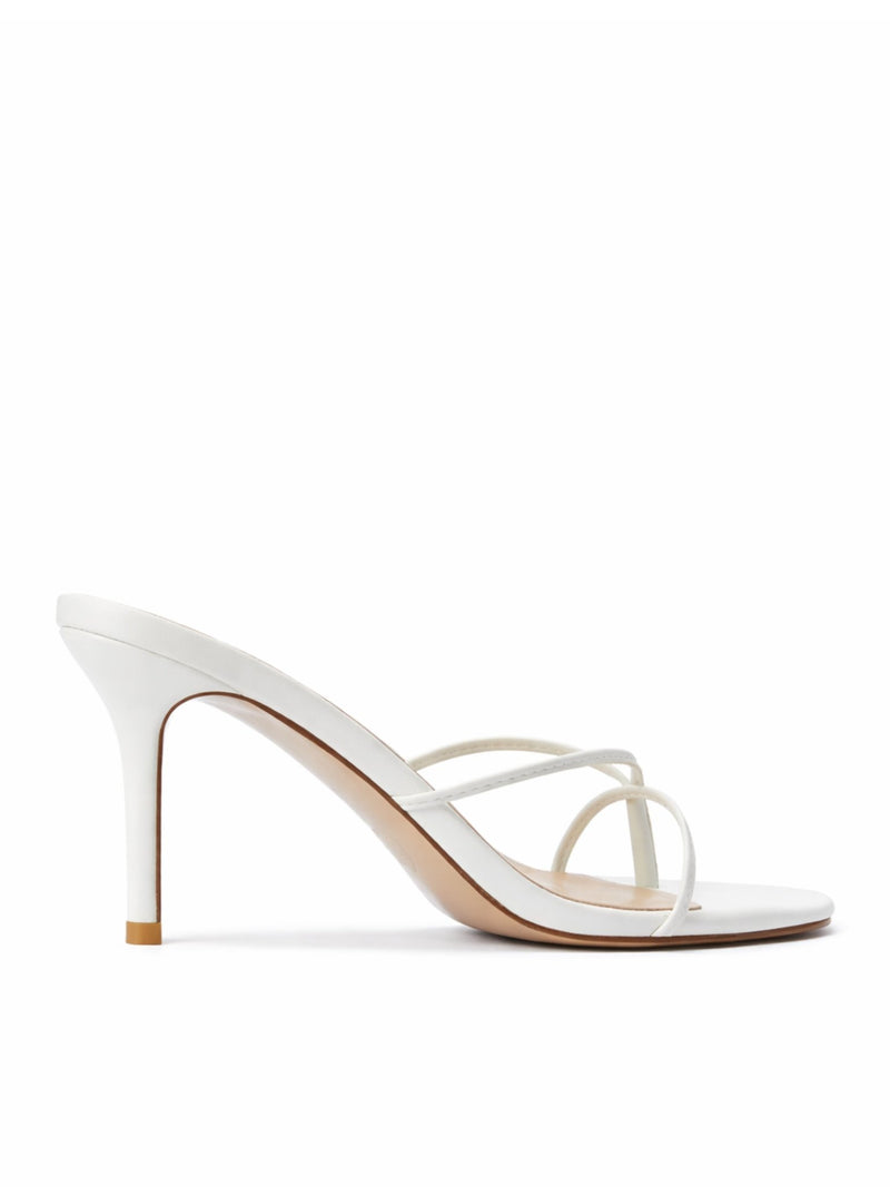 Femme LA Sicilian Slipper in White – side view showing white leather body, slim crossed straps, and nude outsole
